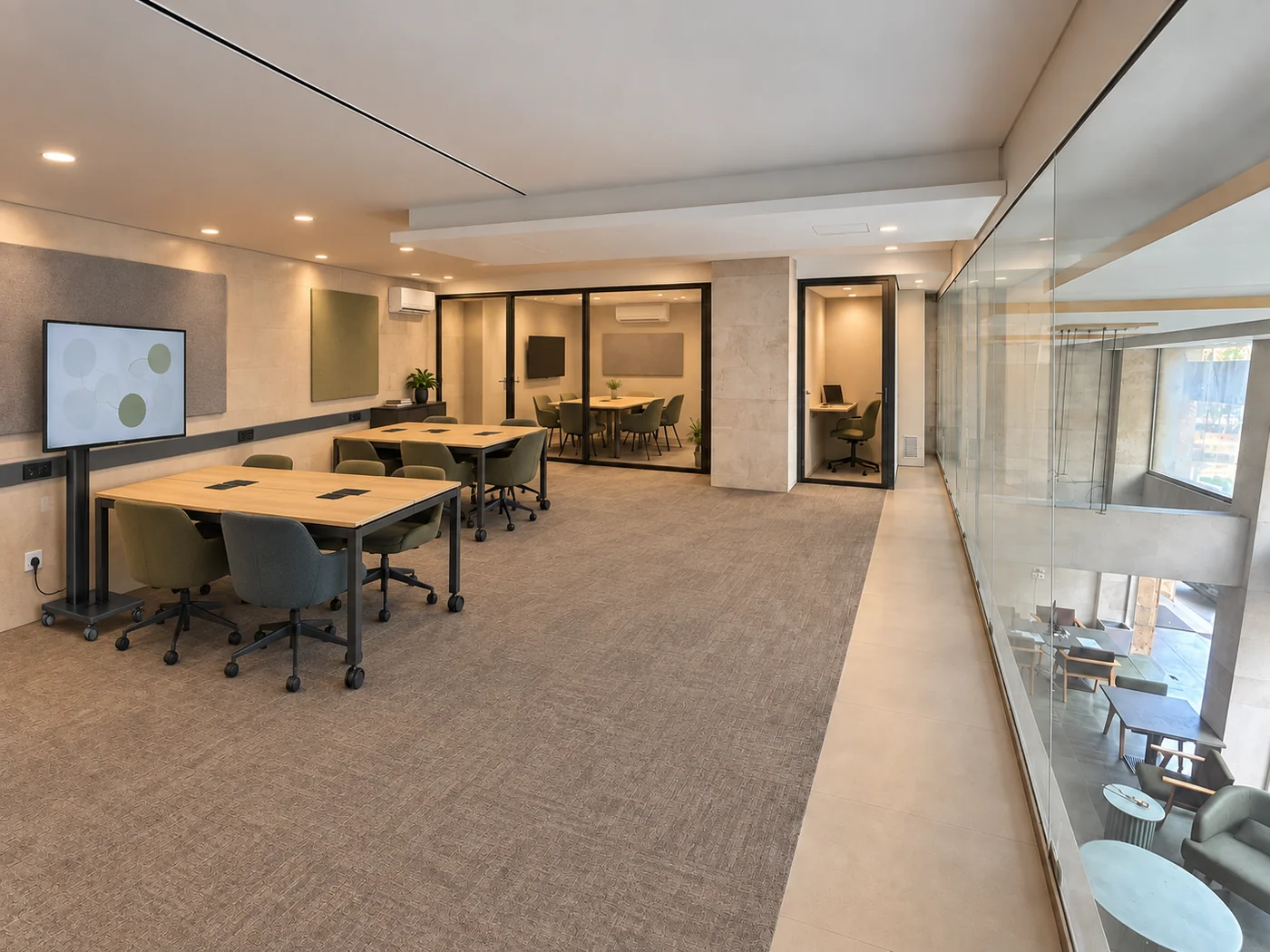 Meeting-space design concept with collaborative tables and an enclosed meeting room